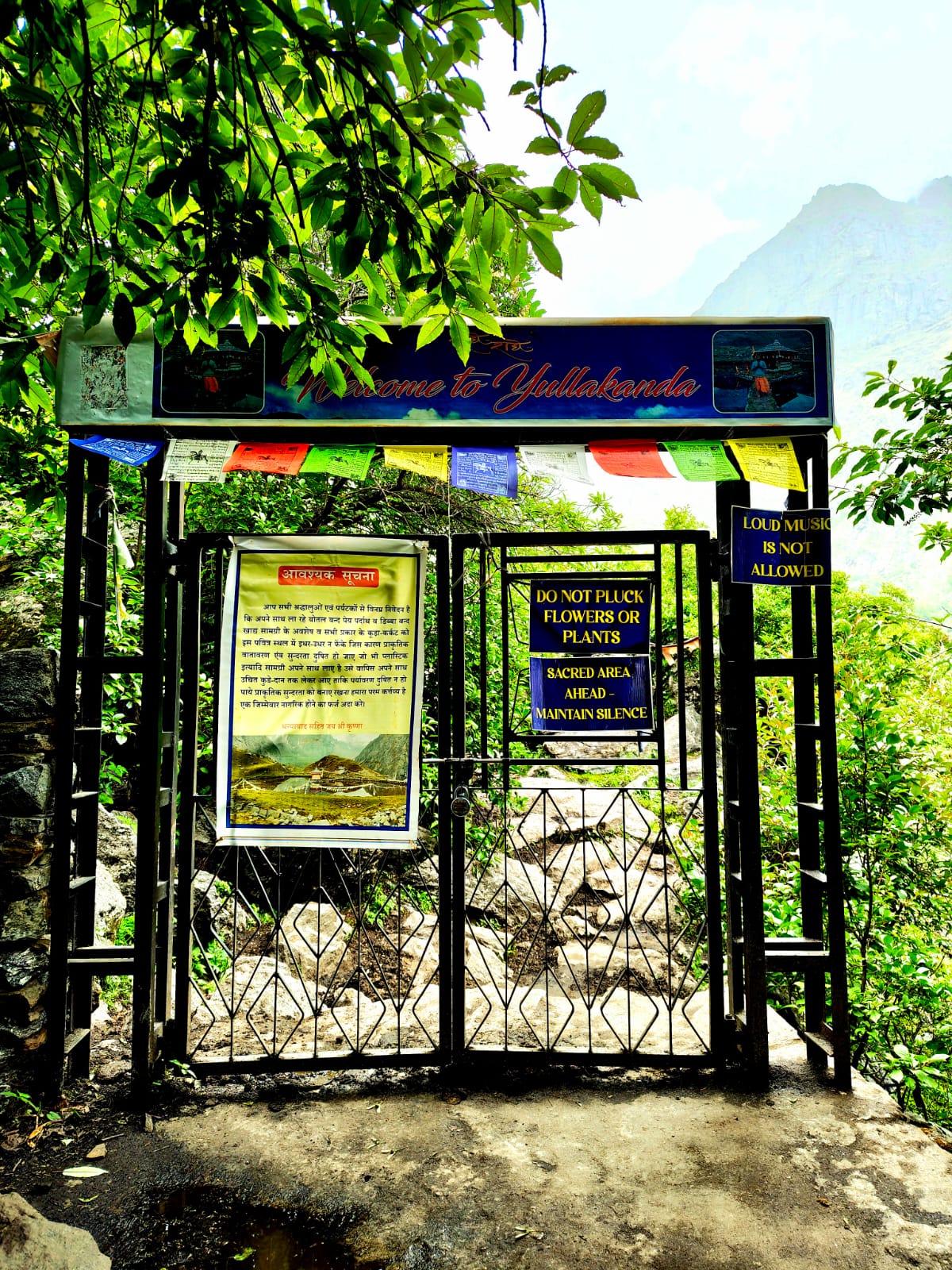 The Night We Got Lost Coming Down From Yulla The iron gate marking the entrance to the protected Yulla Kanda trail, strung with prayer flags and warning signs